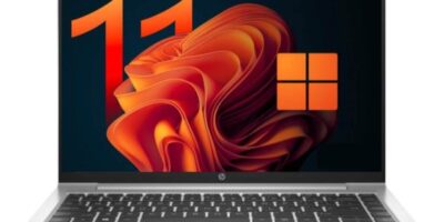Laptop displaying Windows 11 interface for website design and IT services.